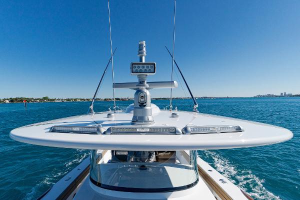 Slide: The Image of Valhalla Boatworks V-46, 2025 model, cruising on clear blue waters under a sunny sky. - 36