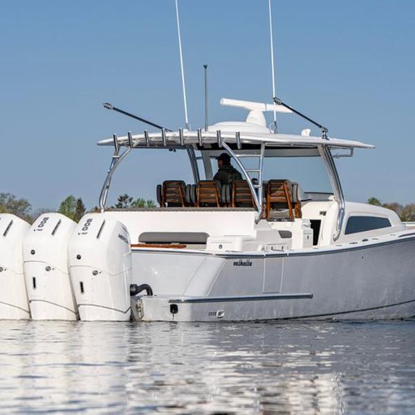 Slide: The Image of 2025 Valhalla Boatworks V-55 with quad outboard engines on calm water. - 1