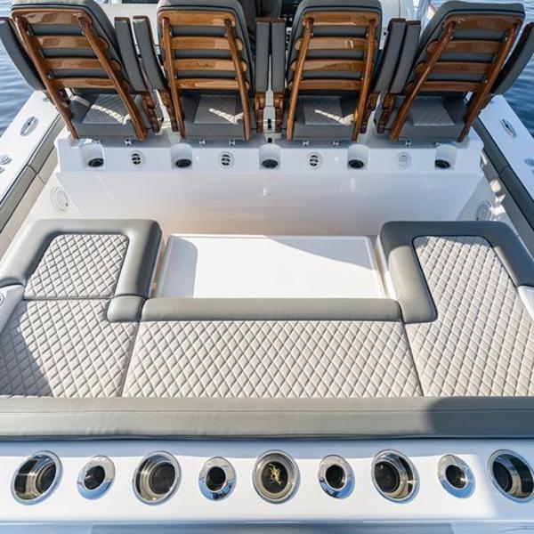 Slide: The Image of 2025 Valhalla Boatworks V-55 luxury seating and rod holders on deck. - 10