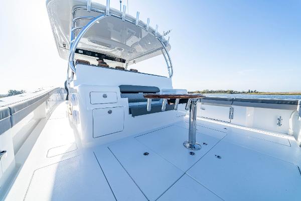 Slide: The Image of 2025 Valhalla Boatworks V-55 deck with seating and table. - 12