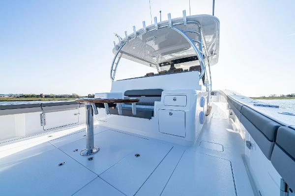Slide: The Image of 2025 Valhalla Boatworks V-55 deck with seating and table. - 14