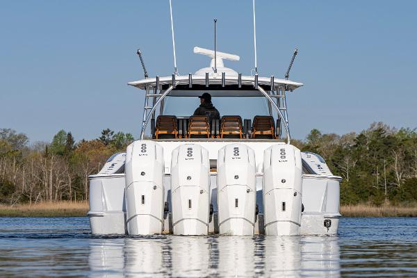 Slide: The Image of 2025 Valhalla Boatworks V-55 with multiple outboard engines on calm water. - 2