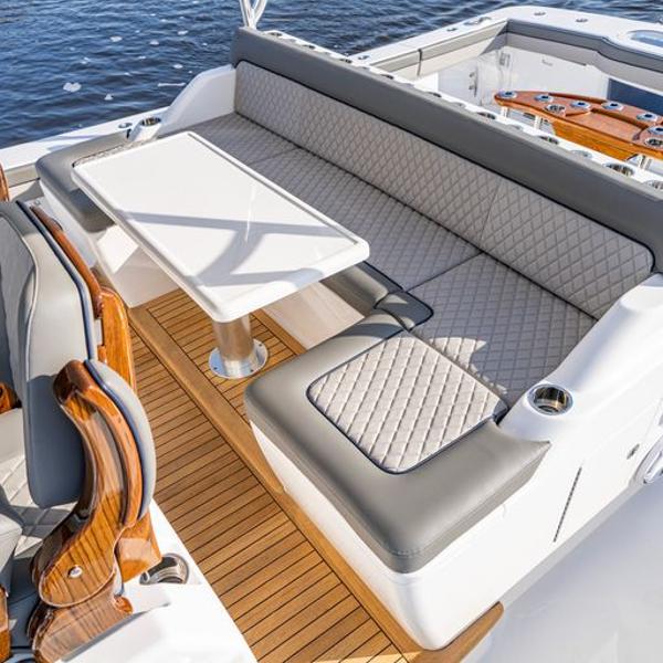 Slide: The Image of Luxurious seating area on the 2025 Valhalla Boatworks V-55 yacht with elegant table and wood accents. - 3