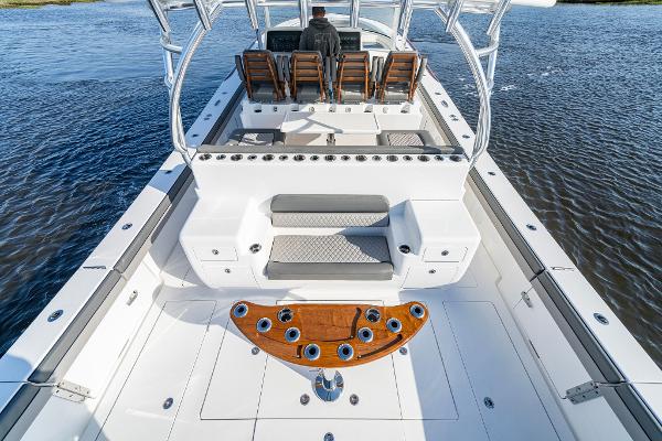 Slide: The Image of 2025 Valhalla Boatworks V-55, spacious deck with seating and rod holders. - 5