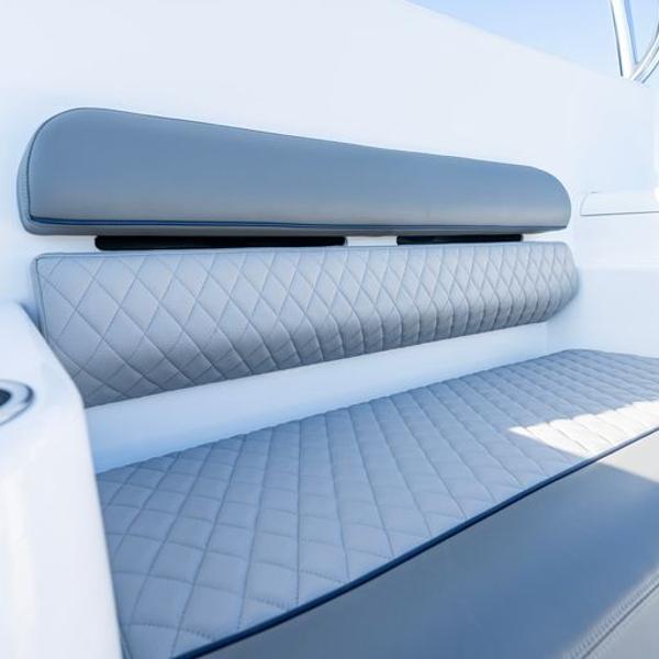 Slide: The Image of Luxurious seating on the 2025 Valhalla Boatworks V-55 with quilted upholstery. - 8