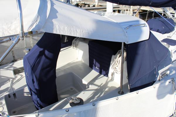 Slide: The Image of 1996 Valiant 42 sailboat cockpit with blue covers and white canopy. - 10
