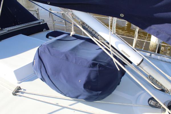 Slide: The Image of 1996 Valiant 42 sailboat deck with blue cover and rigging. - 11