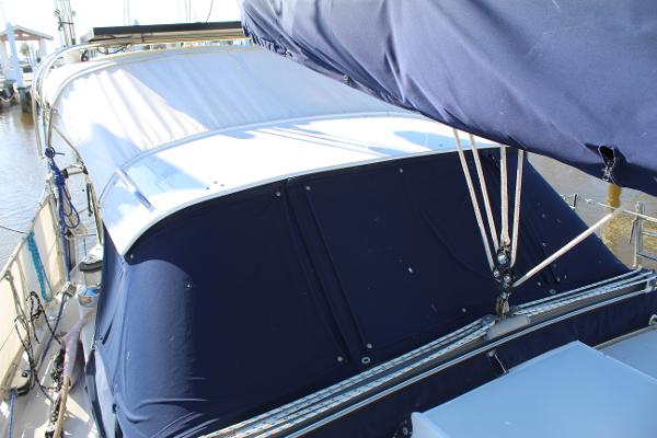 Slide: The Image of 1996 Valiant 42 sailboat with blue canvas covers and rigging. - 13