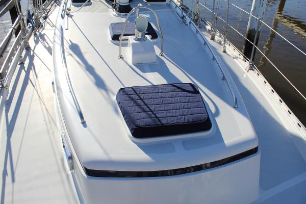 Slide: The Image of 1996 Valiant 42 sailboat deck with blue cushions and railing. - 15