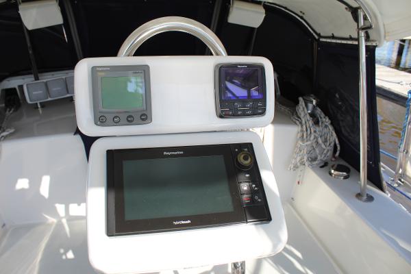 Slide: The Image of 1996 Valiant 42 yacht cockpit with navigation and control instruments. - 17