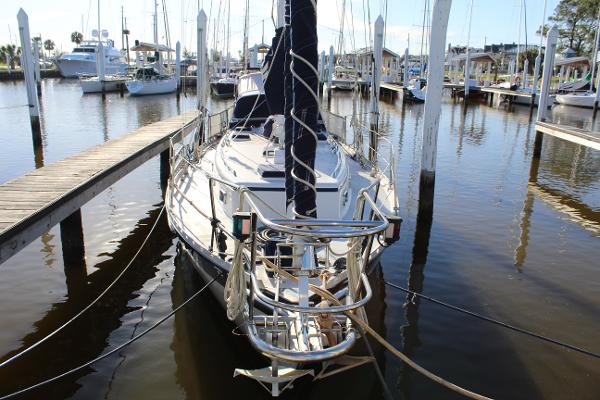 Slide: The Image of 1996 Valiant 42 sailboat docked at a marina. - 2