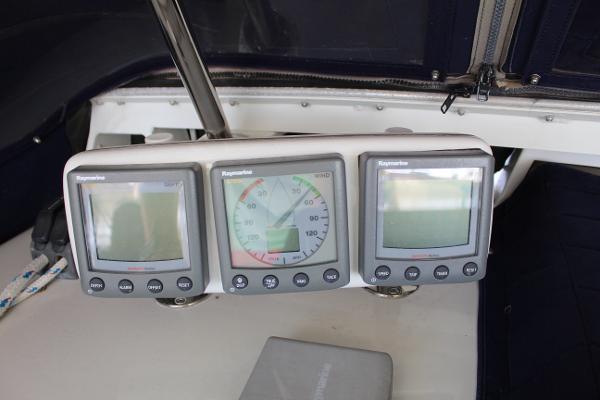 Slide: The Image of Three Raymarine navigation displays on a 1996 Valiant 42 sailboat. - 20