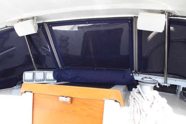 Slide: The Image of 1996 Valiant 42 cockpit with navigation instruments and blue canvas cover. - 21