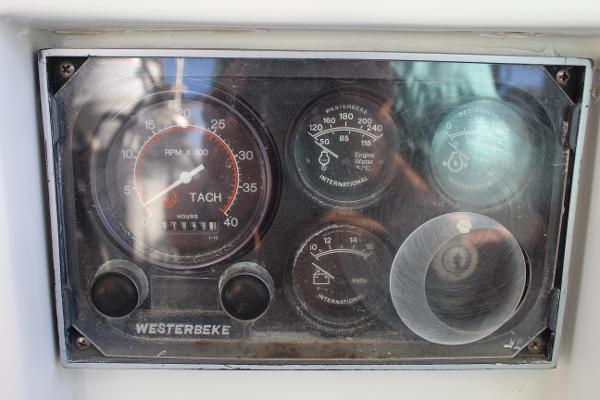 Slide: The Image of 1996 Valiant 42 engine control panel with Westerbeke tachometer and gauges. - 27