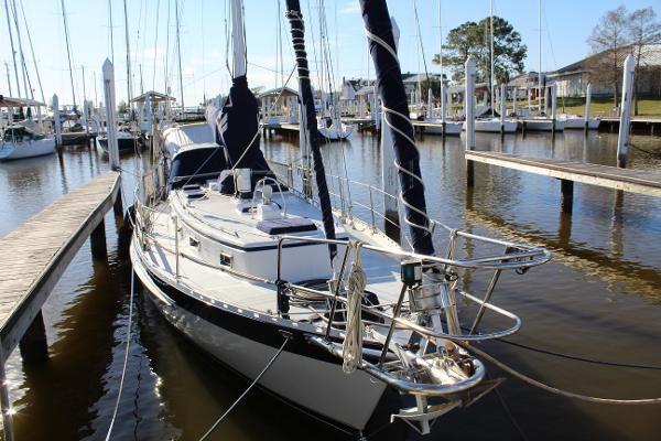 Slide: The Image of 1996 Valiant 42 sailboat docked at a marina. - 3