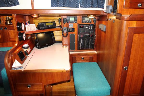 Slide: The Image of Navigation station on a 1996 Valiant 42 sailboat with communication equipment. - 36