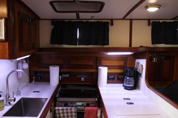 Slide: The Image of 1996 Valiant 42 yacht kitchen with sink, stove, and coffee maker. - 37