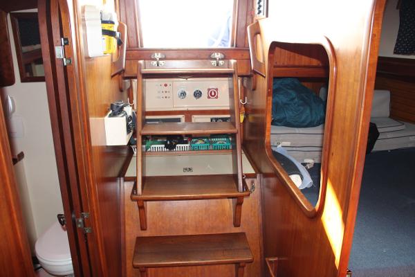 Slide: The Image of Interior of 1996 Valiant 42 sailboat with wooden steps and control panel. - 39