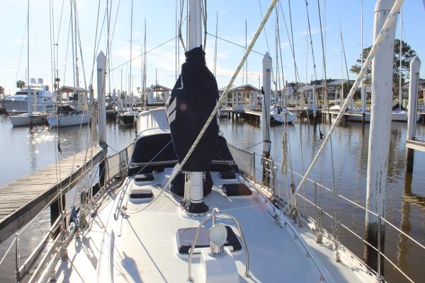 Slide: The Image of 1996 Valiant 42 sailboat docked at a marina on a sunny day. - 6