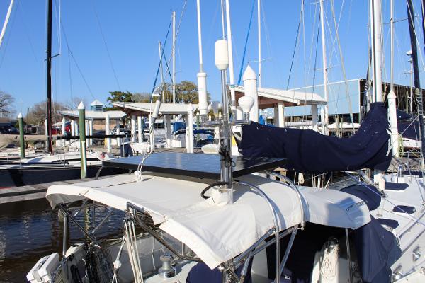 Slide: The Image of Valiant 42 sailboat, 1996 model, docked at marina with blue sky background. - 9
