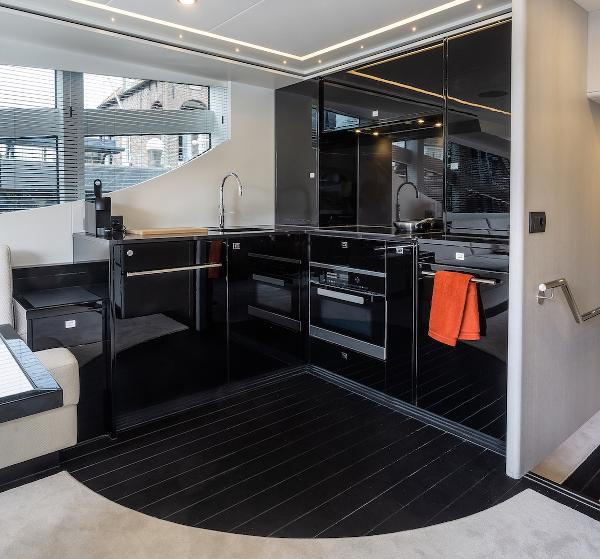 Slide: The Image of Modern kitchen interior of 2026 Van der Valk Beach Club 600 yacht with sleek black cabinetry. - 11