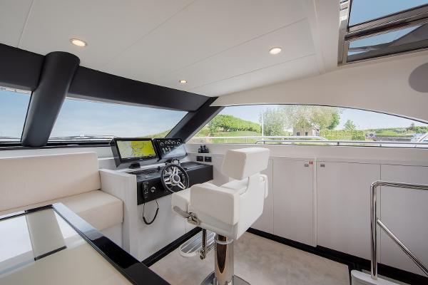 Slide: The Image of Modern helm station of the 2026 Van der Valk Beach Club 600 yacht. - 41