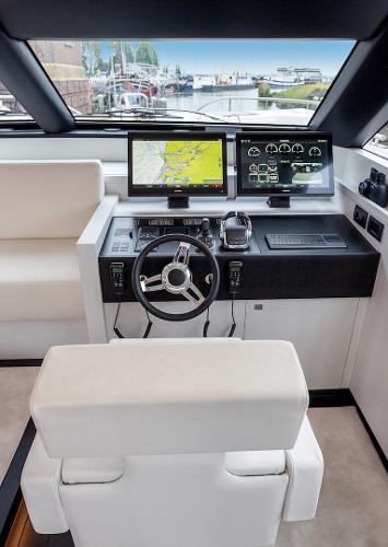Slide: The Image of 2026 Van der Valk Beach Club 600 yacht helm with modern navigation screens and controls. - 43