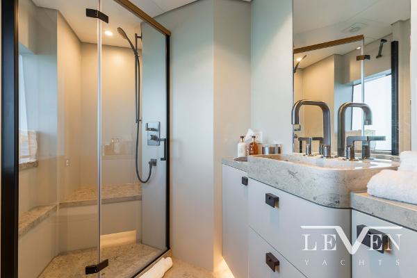 Slide: The Image of Luxurious bathroom in 2026 Van der Valk LeVen 90 yacht with modern fixtures and glass shower. - 24