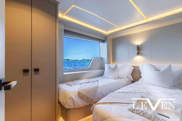 Slide: The Image of Luxurious bedroom interior of 2026 Van der Valk LeVen 90 yacht with ocean view. - 26