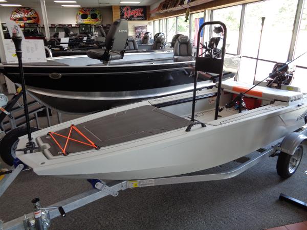 Slide: The Image of 2023 Veer V13 boat on display in showroom, featuring modern design and trailer. - 12