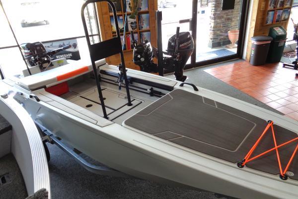 Slide: The Image of 2023 Veer V13 boat on display in a showroom. - 14
