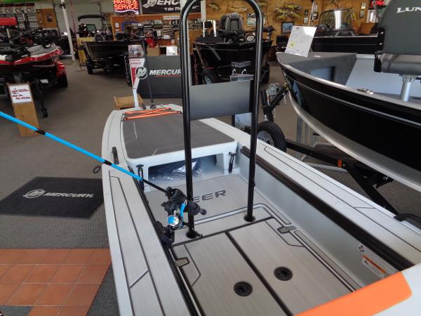 Slide: The Image of 2023 Veer V13 boat on display in showroom with fishing rod holder. - 2