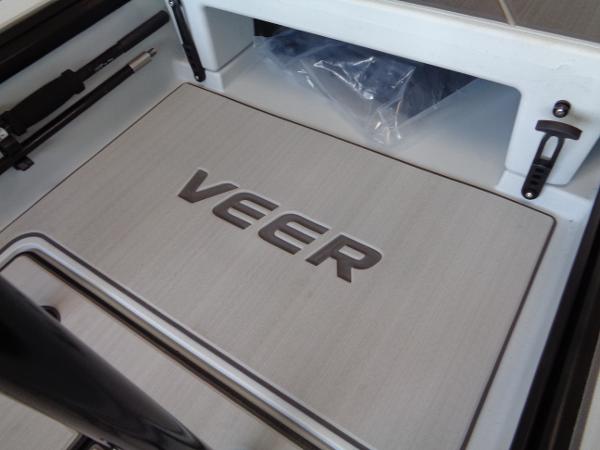 Slide: The Image of Veer V13 2023 model boat interior with logo and storage compartment. - 9