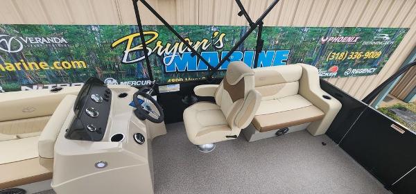 Slide: The Image of 2023 Veranda VISTA20RC Bi-Toon boat interior with beige seating and control console. - 14