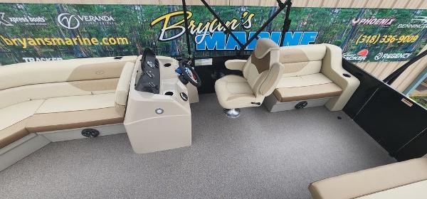 Slide: The Image of 2023 Veranda VISTA20RC Bi-Toon boat interior with beige seating and control console. - 16