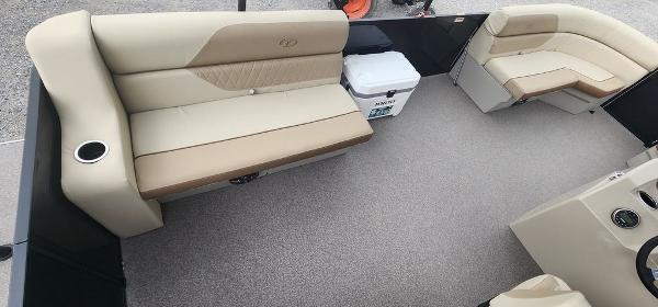 Slide: The Image of 2023 Veranda VISTA20RC Bi-Toon boat interior with beige seating and cooler. - 18