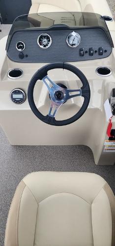 Slide: The Image of 2023 Veranda VISTA20RC Bi-Toon boat dashboard with steering wheel and gauges. - 26