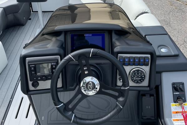 Slide: The Image of 2024 Veranda VP 22RC boat dashboard with steering wheel and control panel. - 1