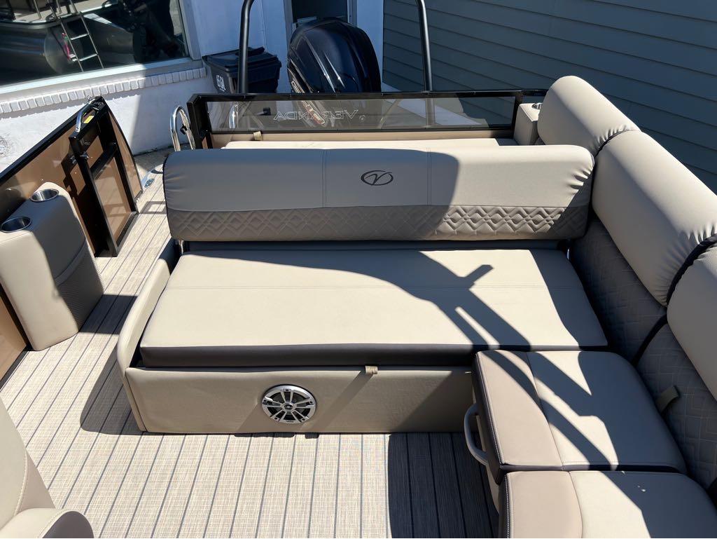 Slide: The Image of 2023 Veranda VP 22 VLB boat interior with beige seating and speaker. - 10