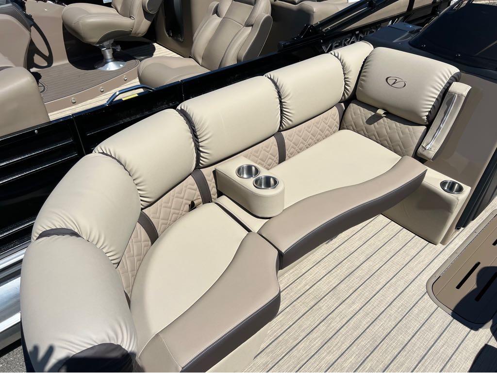 Slide: The Image of 2023 Veranda VP 22 VLB boat interior with beige cushioned seating and cup holders. - 15