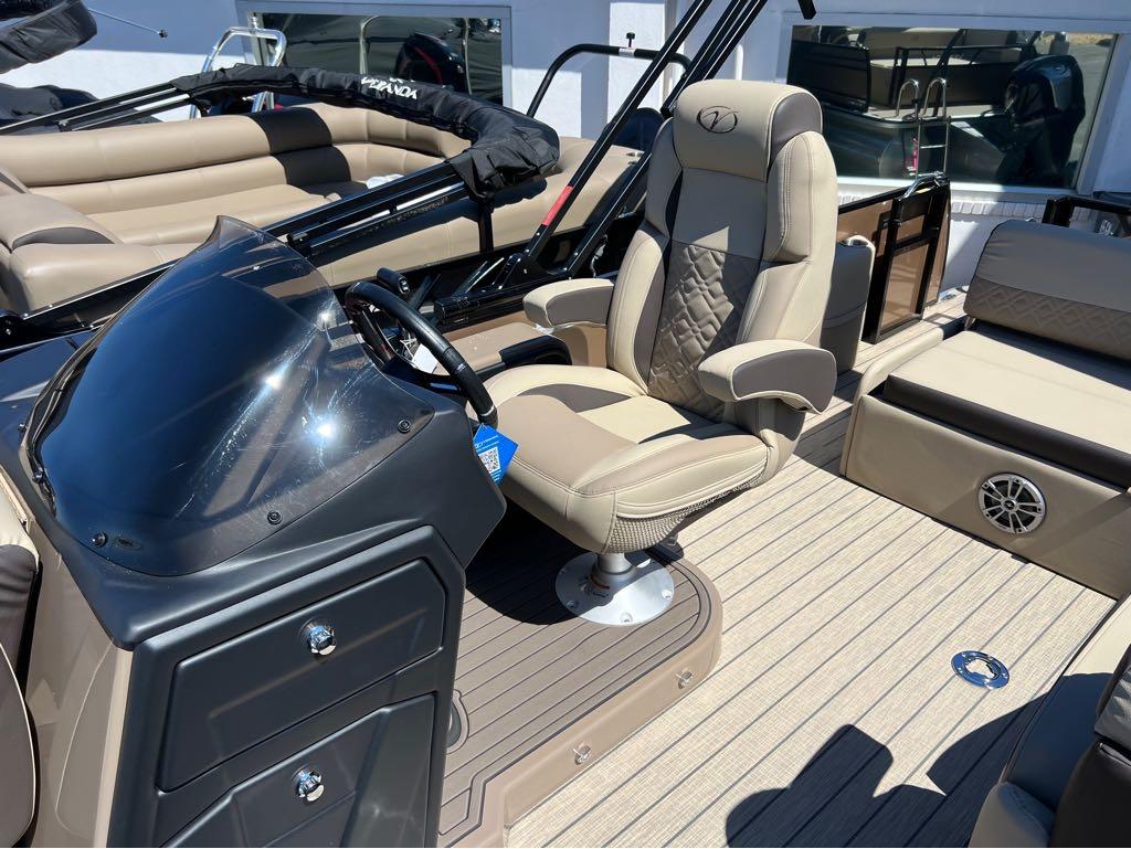 Slide: The Image of 2023 Veranda VP 22 VLB boat interior with captain's chair and dashboard. - 16