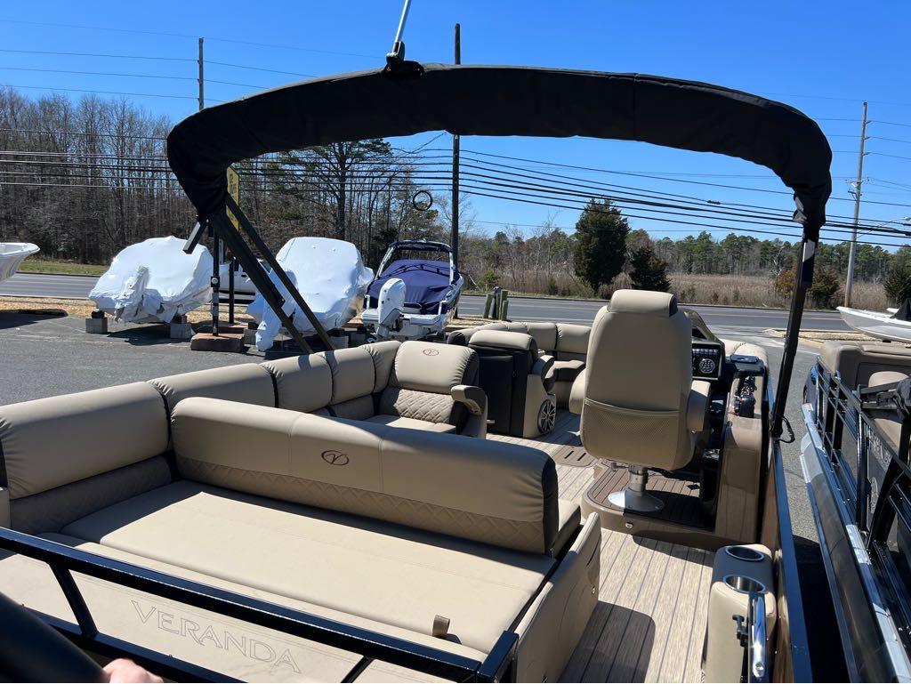 Slide: The Image of 2023 Veranda VP 22 VLB pontoon boat with beige seating and black canopy. - 17