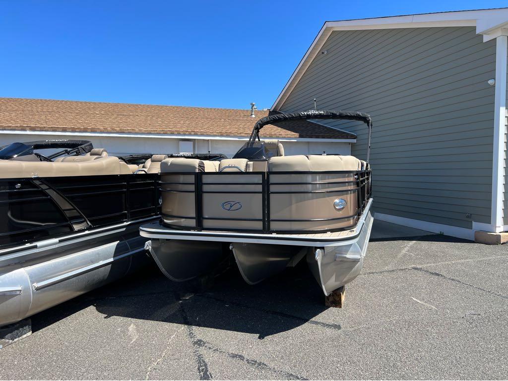 Slide: The Image of 2023 Veranda VP 22 VLB pontoon boat parked near a building. - 5