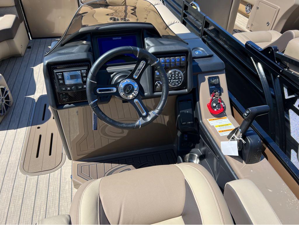 Slide: The Image of 2023 Veranda VP 22 VLB boat dashboard with steering wheel and control panel. - 6