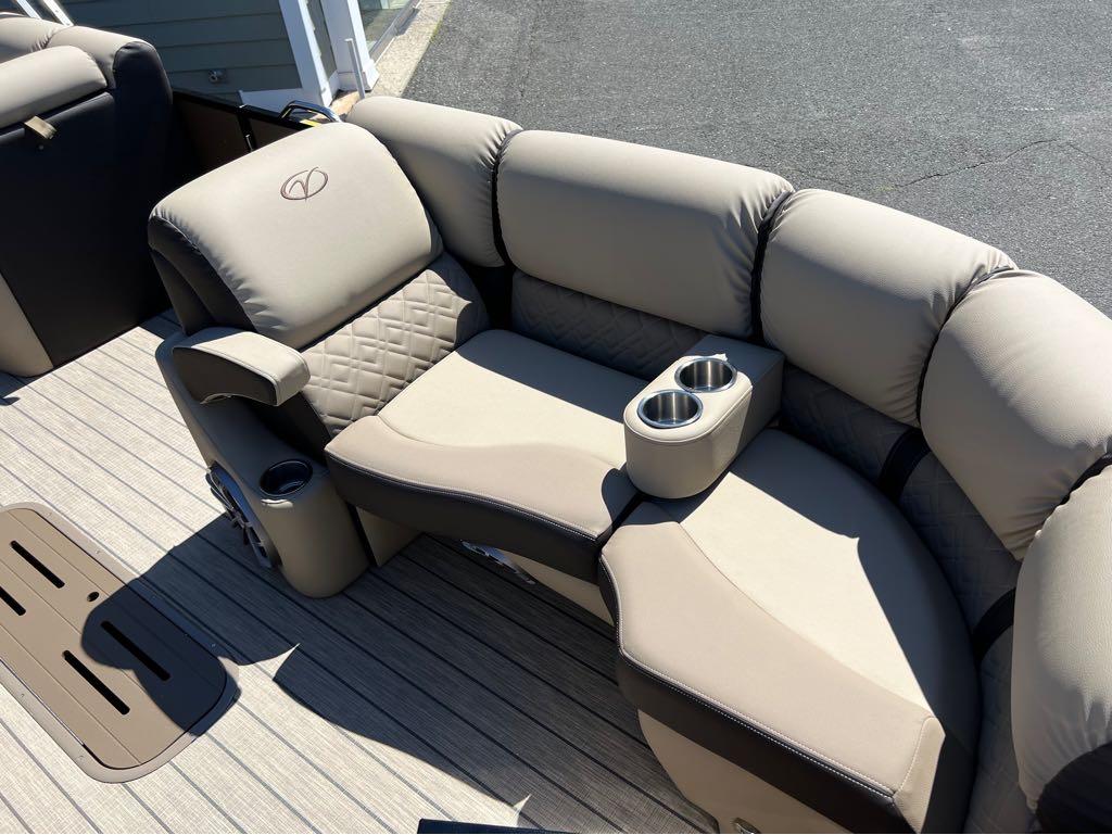 Slide: The Image of 2023 Veranda VP 22 VLB boat interior with beige cushioned seating and cup holders. - 8