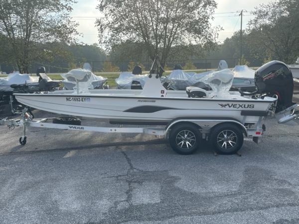 Slide: The Image of 2022 Vexus 1980 CC boat on a trailer in a parking lot. - 3
