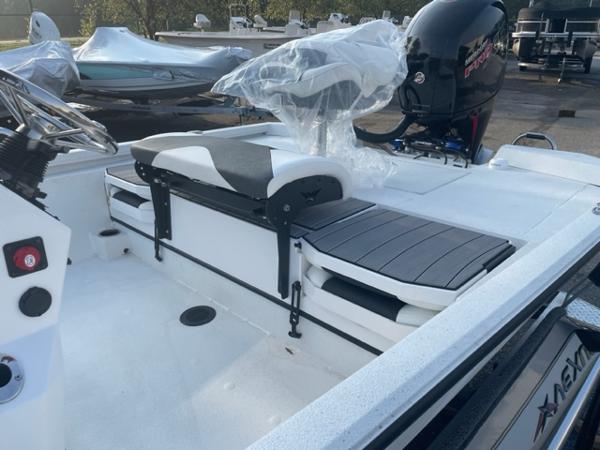 Slide: The Image of 2022 Vexus 1980 CC boat interior with seating and motor. - 6