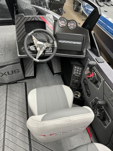 Slide: The Image of 2024 Vexus DVX19S boat cockpit with steering wheel and Humminbird electronics. - 4