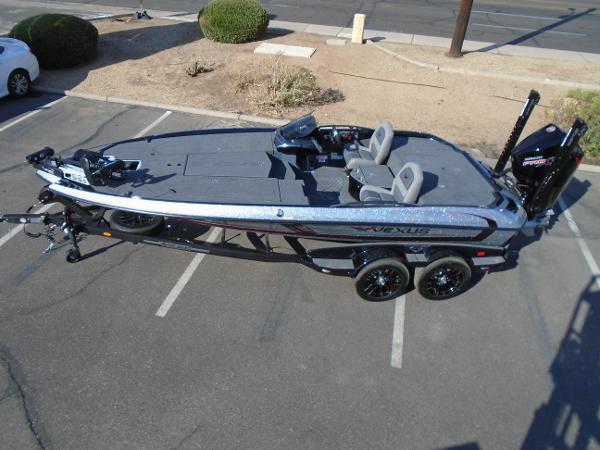 Slide: The Image of 2024 Vexus VX20 bass boat on trailer in parking lot. - 11