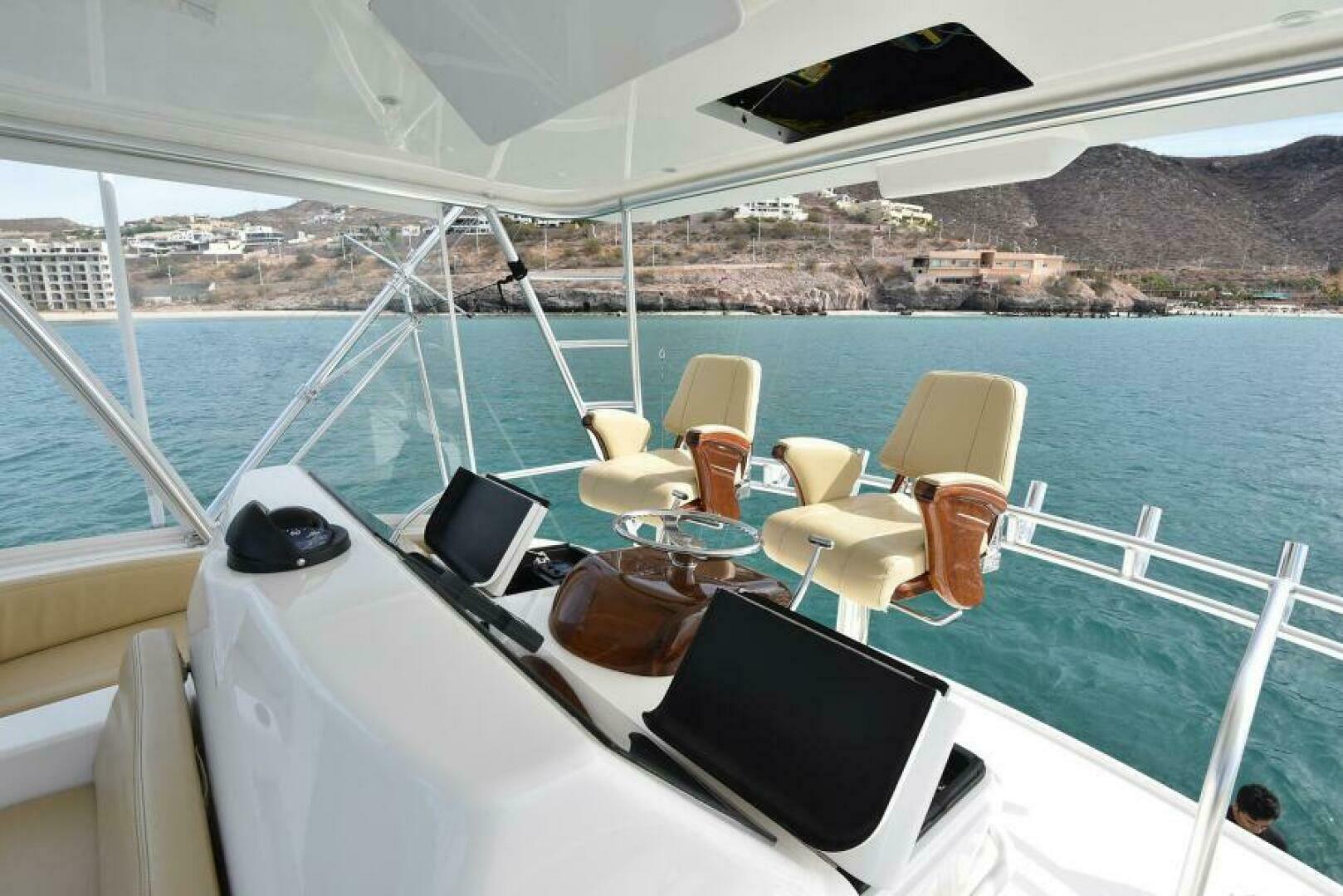 Slide: The Image of 2019 Viking 44 Convertible MY WAY Flybridge Helm - 5471835